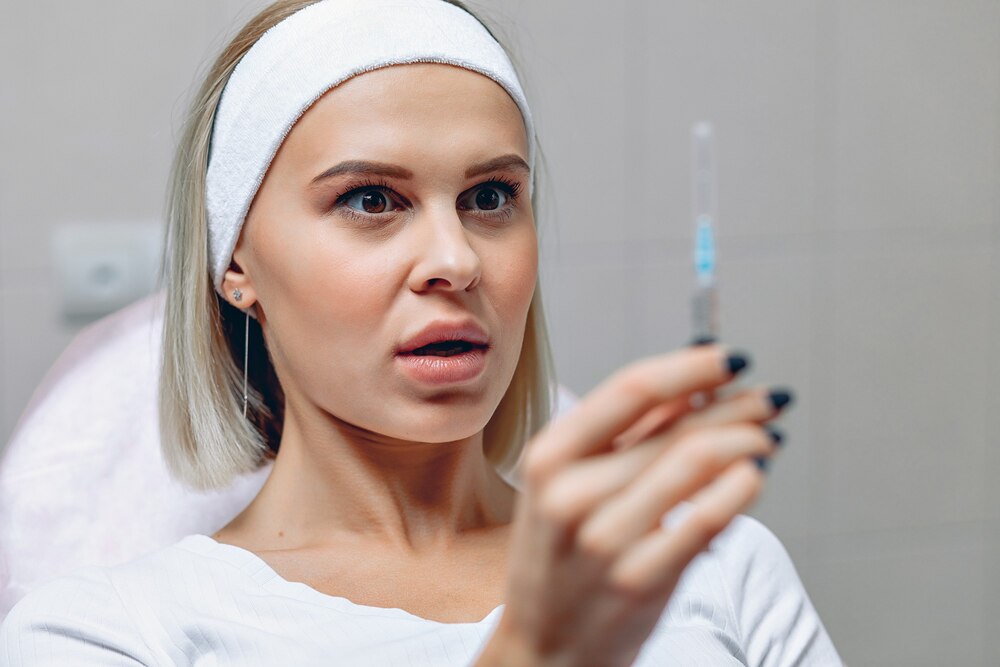 portrait-beautiful-frightened-woman-holding-syringe-her-hands-looking-him-with-fear_161422-248.jpg