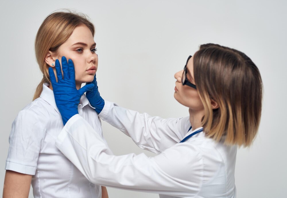 woman-doctor-medical-gown-blue-gloves-with-stethoscope-around-her-neck-female-patient_163305-187824.jpg