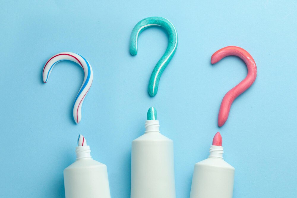 question-mark-from-toothpaste-concept-choosing-good-toothpaste-teeth-whitening-tube-colored-toothpaste-blue-background-copy-space-text_188237-2997.jpg